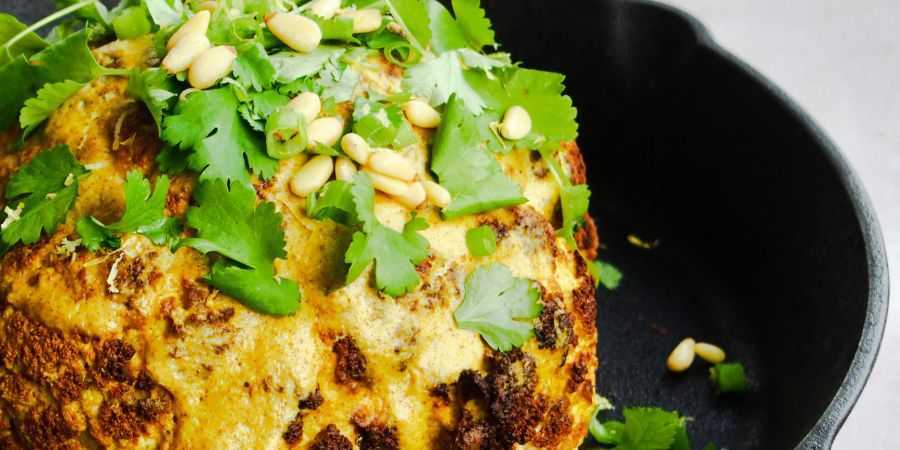 Close up of roasted cauliflower in fry pan.