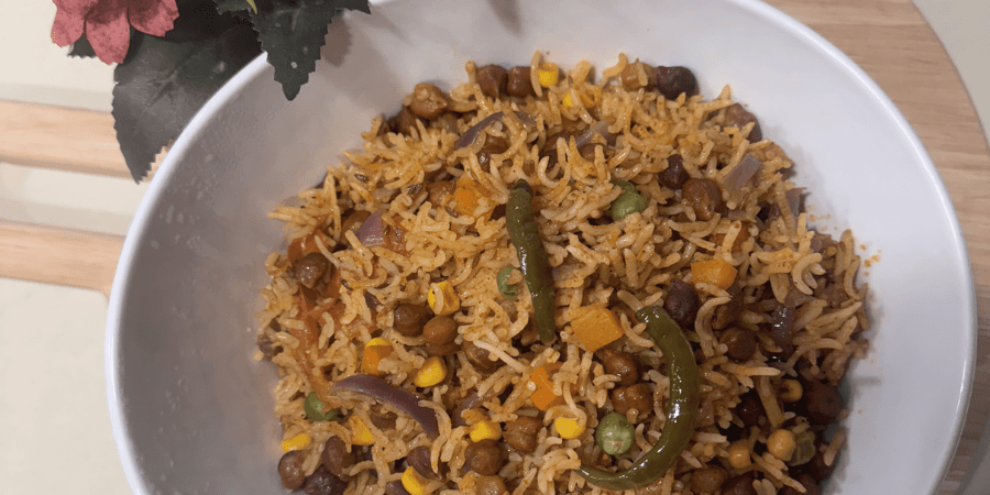 A bowl of high protein vegetables mixed with rice