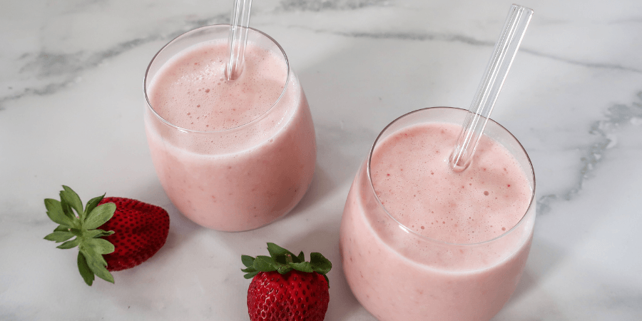 Kefir berry and banana smoothies with strawberries on the side